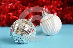 Shiny toys balls on the Christmas tree for the new year holiday