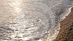 Shiny Tropic Sea Wave on Golden Beach Sand in Sunset. Beautiful Sea waves. Soft Wave Of Blue Ocean.