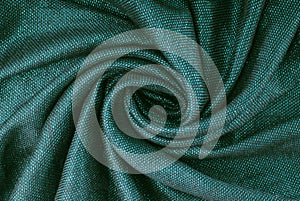 Shiny turquoise fabric, dark bluish-green colour cloth, glamour evening teal material, bright draped greenish-blue textile,