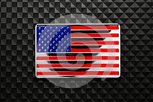 Shiny US American flag emblem on carbon fiber. Symbolizing USA strength, Memorial day, Veteran\'s day