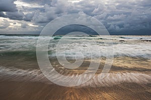 Shiny water seascape with stormy clouds