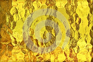 Shiny yellow gold foil abstract texture background