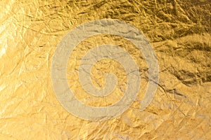 Shiny yellow leaf gold foil texture background