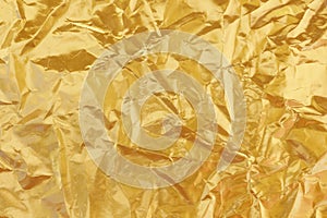 Shiny yellow leaf gold foil texture background