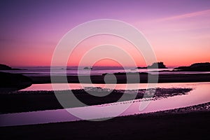 Ship across the ocean at Sunset, in Tofino beach photo