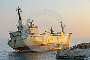 Ship aground near rocky coast