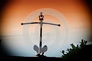 Ship anchor on a wall.