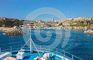 The ship arrives at the port of M?arr on the island of Gozo, Malta. photo