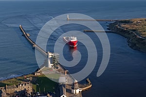 Ship arriving at Aberdeen harbour after passing Girdle Ness Lighthouse