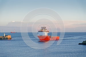 Ship arriving at Aberdeen harbour after passing Girdle Ness Lighthouse