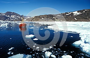 Ship in the artic sea by eastern Greenland