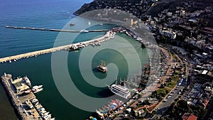 Ship bay of southern port city. Clip. Top view of beautiful bay for sailing ships near resort port city. Ship port with
