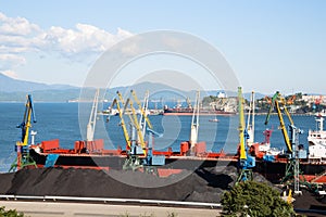 Ship is being loaded with coal in port of Nakhodka