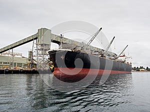 Ship being loaded in port