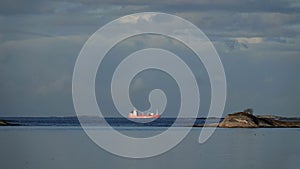 Ship on blue ocean water from Storlauvoya on the Atlantic road in More og Romsdal in Norway