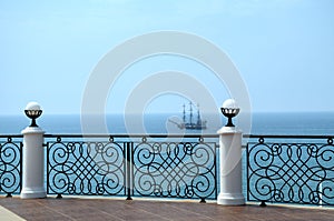 Ship on blue water wiew from embankment