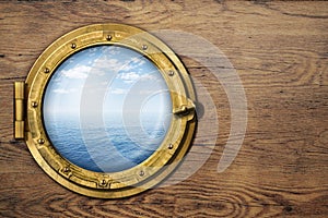 Ship or boat porthole on wooden wall