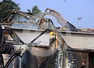 Ship Breaker Gas Cutter demolishing part of INS Vikrant in Darukhana Ship Breaking Yard (close up) photo