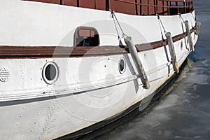 Ship broadside frozen in ice photo