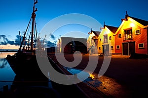 Ship and buildings in Zoutkamp in dusk