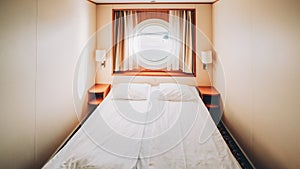 Ship Cabin With Bed And Window With View On Sea. Luxury Cabin On Ferry Boat Or Cruise Liner.