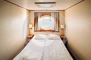 Ship Cabin With Bed And Window With View On Sea. Luxury Cabin On Ferry Boat Or Cruise Liner.