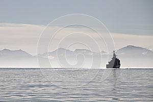 Ship on a calm sea in Svalbard islands, Norway