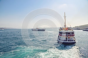 The ship carries passengers along the Bosporus Strait.n