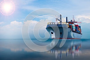 Ship with container on blue sky.