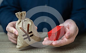 Ship container and Chinese yuan or japanese yen money bag.