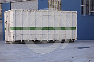 Ship container at the gate of a factory