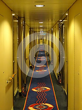 Ship corridor leading to rooms recedes into the distance