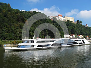 Ship on Danube river under the old Castle