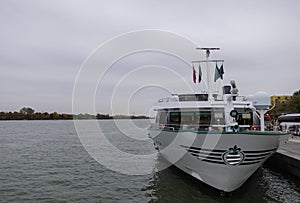 ship on the danube river in vienna with gray clouds