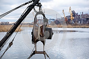 ship equipment against the background of the destroyed Azovstal plant in Ukraine
