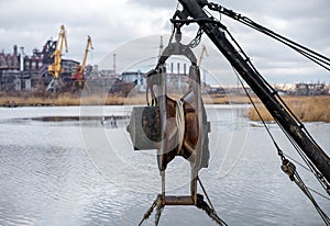 ship equipment against the background of the destroyed Azovstal plant in Ukraine