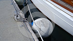 Ship fender is an air-filled ball used to absorb the kinetic energy of a boat or vessel.