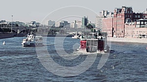 A ship floating on the river of the city canal