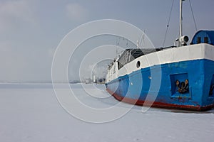 The ship froze in the ice. The frozen river took the ship into captivity. On the Volga ice.