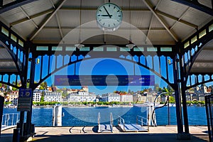 Ship harbor in the center of Lucerne city with the old town and Lucerne lake in the background.