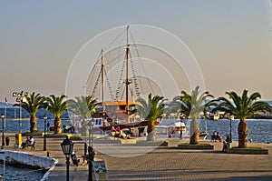 Ship in harbor of Neos Marmaros at golden hour, Sithonia photo