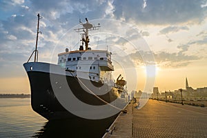 Ship at harbor in Rostock at sunset