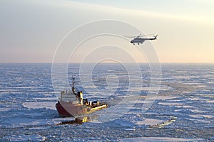 Ship and helicopter in the Arctic