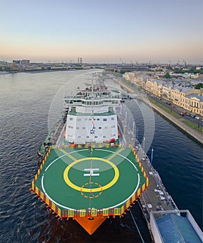 ship with a helipad in the river port of St. Petersburg