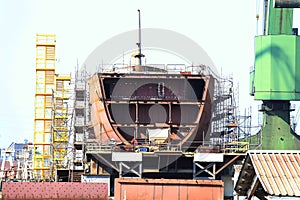 ship hull under construction at shipyard