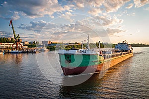 The ship `Lama` sails on the Volga River near the city of Rybinsk
