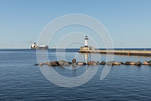 A Ship And A Lighthouse On Lake Superior