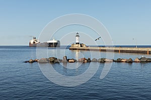 A Ship And A Lighthouse On Lake Superior
