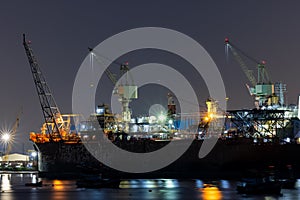 Ship Maintenance in Dry Dock at Night