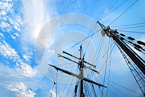 Ship masts rigging, blue sky